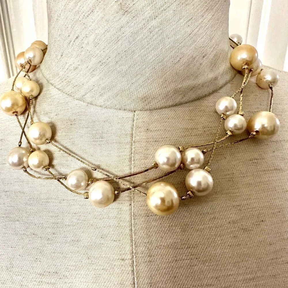 Faux pearl multi strand gold tone necklace